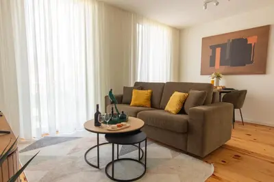 a living room with a couch and a table at ORM - Cedofeita II Apartment in Porto