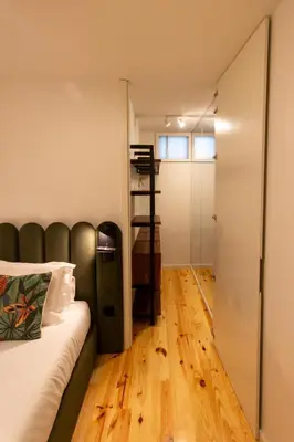 a bedroom with a bed and a sliding door at ORM - Cedofeita II Apartment in Porto