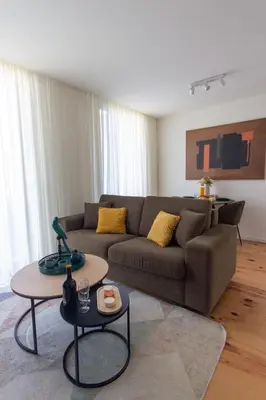a living room with a couch and a table at ORM - Cedofeita II Apartment in Porto