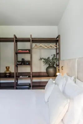 a bedroom with a bed with white pillows at Regras Apartments & Garden by Benefit Collection B in Porto