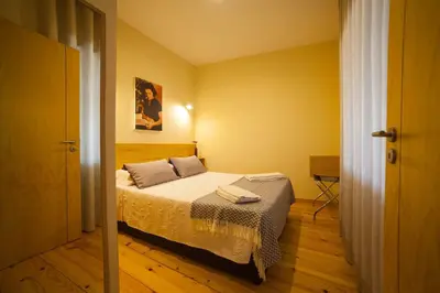 a bedroom with a bed in a room at Cedofeita Back Garden in Porto