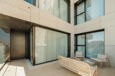 a restaurant with tables and chairs and a kitchen at ABC Hotel Porto - Campanhã in Porto