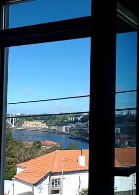 a view of a river from a window at Castelo River View - NEW in Vila Nova de Gaia