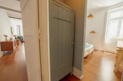a sliding door in a room with a bedroom at Downtown Retro Bolhao by Vacationy in Porto
