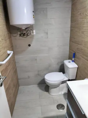a bathroom with a toilet and a sink at Casa Pedro Hispano 3B in Porto
