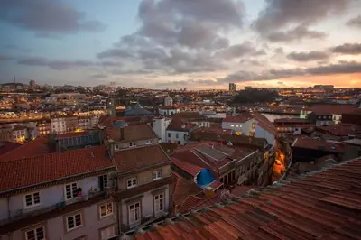 a view of a city with roofs and buildings at Being Porto Hostel in Porto