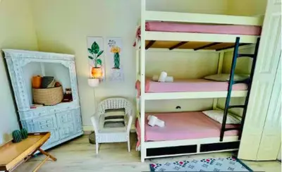 a bedroom with a large bed with a yellow blanket at aiPorto downtown, family&friends 2! in Porto