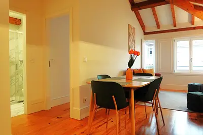 a dining room and living room with a table and chairs at PORTO SWEETHEART - Ricardo Jorge in Porto
