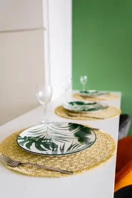 a table with two plates and a wine glass at Green Universe Porto by MyMoradia in Porto