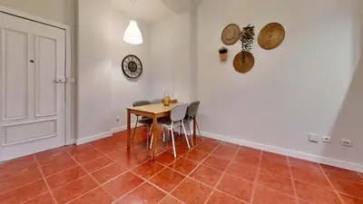 a dining room with a table and chairs at Porto Sweet Home in Porto
