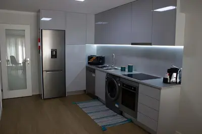 a kitchen with a sink and a dishwasher at Douro Sunset Terrace in Vila Nova de Gaia