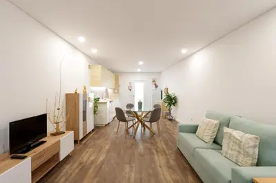 a living room with a couch and a table at VIVA Spacious Apartment Campanhã in Porto
