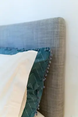 a close up of a pillow on a couch at Groovy Porto by Upperground in Porto