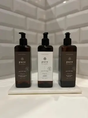 three bottles oficating products sitting on a shelf at Groovy Porto by Upperground in Porto