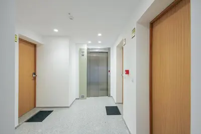 a corridor of an office building with a hallway at Blue Hotel Oporto in Porto