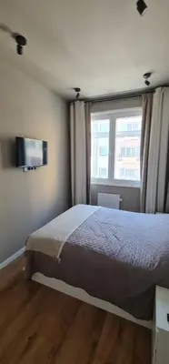 a bedroom with a large bed and a window at Cantinho da Boavista in Porto