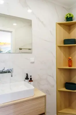 a bathroom with a white sink and a mirror at Lighthouse by MyMoradia I Vue & Élégance à Porto in Porto