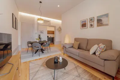 a living room with a couch and a table at Heart of Porto Apartments by Vacationy in Porto
