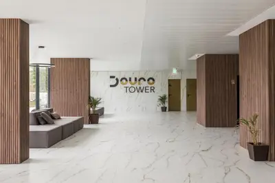 a lobby with a round turnover sign on the wall at Douro Tower Loft - Shared Pool in Vila Nova de Gaia