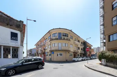a red door on the side of a building at VIVA Elias Sunset Apartment Gaia in Vila Nova de Gaia