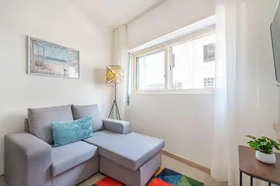 a white closet with white shelves in a bedroom at VIVA Elias Sunset Apartment Gaia in Vila Nova de Gaia
