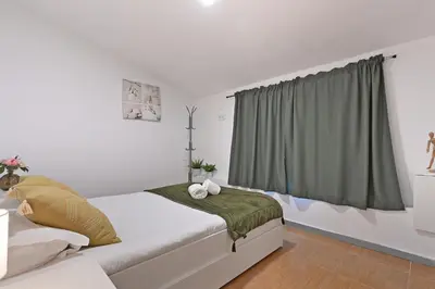 a bedroom with a bed and a window at The Porto Way in Porto