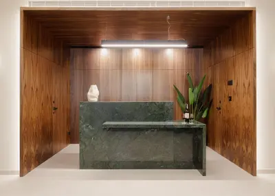 a bathroom with a green counter and wooden walls at Porto River Soul Hotel in Vila Nova de Gaia