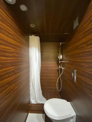a bathroom with a toilet and a shower at Sunny Apartment in Porto