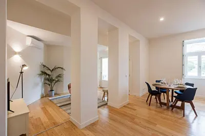 a dining room with a table and chairs at Superb Flat w Balcony and AC by LovelyStay in Porto