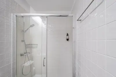 a shower with a glass door in a bathroom at GuestReady - Explore Porto from a prime location in Porto