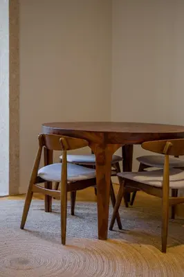 a wooden table and a chair next to a table at Almada 151 - 1T in Porto