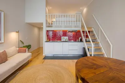 a living room with a couch and a table at Almada 151 - 2F in Porto