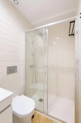 a bathroom with a shower and a toilet at VIVA João IV Residence Studios in Porto