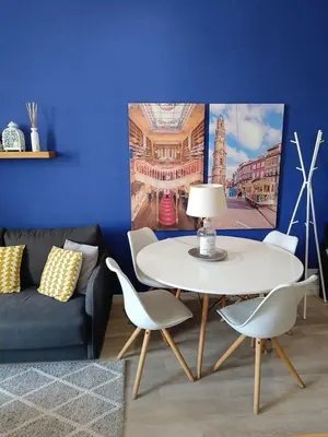 a living room with a table and chairs and a couch at Porto Alma 388 - Silent city center in Porto