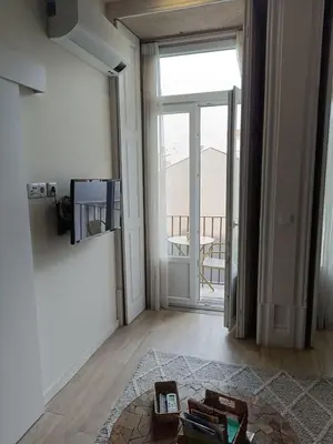 a living room with a door open to a balcony at Porto Alma 388 - Silent city center in Porto