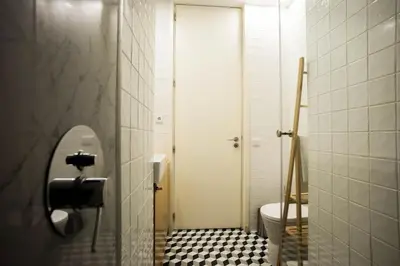 a bathroom with a toilet and a sink at PortoCenter METRO Marquis Cozy apartment in Porto