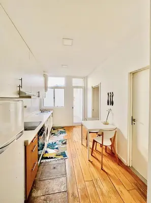 a kitchen with a table and a tableasteryasteryasteryasteryasteryasteryasteryastery at Porto Boavista Patio House in Porto