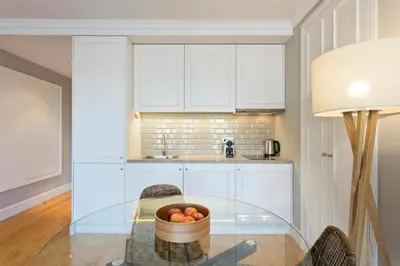 a kitchen with a glass table with a bowl of fruit at Historical Corner by Upperground in Porto
