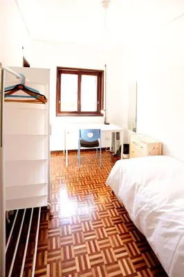 a bedroom with a desk and a bed and a desk at Baron Omega in Porto