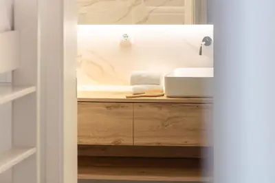 a bathroom with a sink and a counter at Bom Retiro's Delight by LovelyStay in Porto