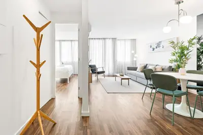 a gym with treadmills and ellipticals in a room at Urban Retreat with Balcony, Bright and Central Porto in Porto