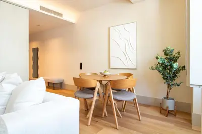 a living room with a table and chairs at Catarina 392 by LovelyStay in Porto