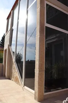 a large glass window on the side of a building at Well at Home in Vila Nova de Gaia