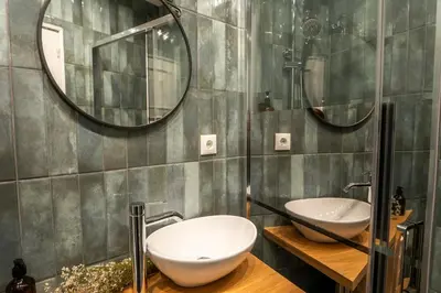 a bathroom with two sinks and a mirror at 3BR Flat by Casa da Música, Central, Sleeps 6, E in Porto