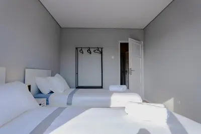 two beds in a bedroom with white walls at 3BR Flat by Casa da Música, Central, Sleeps 6, E in Porto