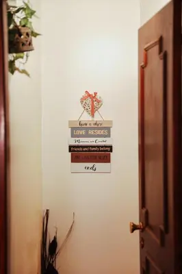 a bedroom with two beds and a chair and a mirror at Sailor's House 3 - Casa dos Bibos in Porto