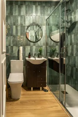 a bathroom with a toilet and a sink and a mirror at 3BR Flat by Casa da Música, Central, Sleeps 6, 2D in Porto
