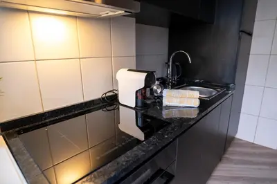 a kitchen counter with a sink and a toilet paper dispenser at 3BR Flat by Casa da Música, Central, Sleeps 6, 2D in Porto