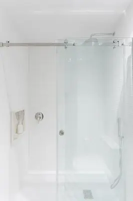 a bathroom with a shower with a glass door at Candy Crush in Porto