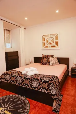 a bedroom with a bed with towels on it at Sailor's House - Holiday's House in Porto